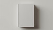 Minimalist white book cover mockup on a plain background, ideal for design presentations.