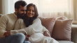 Celebrating Parenthood, Happy Indian Couple Embracing at Home