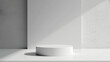 © Blackmint Studio - White hard pedestal on isolated white background sleek geometric design. Studio podium spotlight