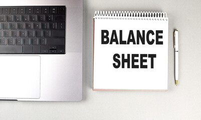 Poster - BALANCE SHEET text on notebook with laptop and pen