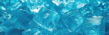 Frozen Water Takes Center Stage Against A Bluish Background, Embodied By Glistening Ice Cubes.