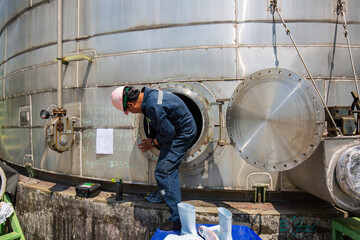 Male into the manhole  tank stainless chemical area confined space