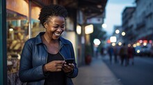 Happy Smiling Mid Adult Woman Is Using A Smartphone Outdoors
