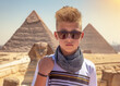 Pyramids of Giza, Egypt. A portrait of teenager tourist