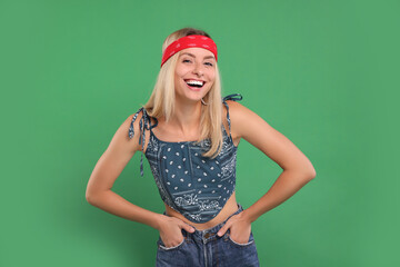 Poster - Portrait of happy hippie woman on green background