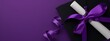 A traditional black graduation cap with a vibrant purple tassel is paired with a white diploma tied with a purple  ribbon. The bold contrast against a deep purple background emphasizes the ceremonial 