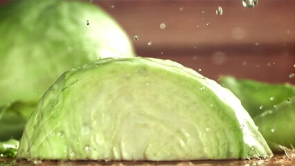 Poster - Drops of water fall on the cabbage. Filmed on a high-speed camera at 1000 fps. High quality FullHD footage