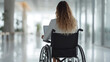 © visoot - Close-up Businesswoman on the wheelchair working on the laptop in the modern white office. Generative AI.