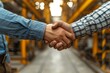 © Hitesh - Two men builder and architect shake hands at construction site