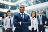 Fototapeta  - Happy proud prosperous mid aged mature professional business man ceo executive wearing suit standing in office arms crossed, leadership