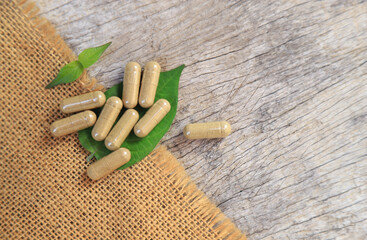 Top view of herbal medicine in capsules from organic herb for health care eating