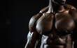 © Cadengo - Bodybuilder in a pose on a black background close-up