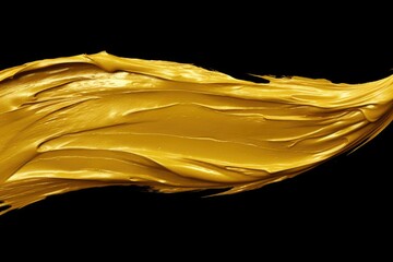 Poster - Gold paint is shown in a close up on a black background. This image can be used for various artistic and creative projects