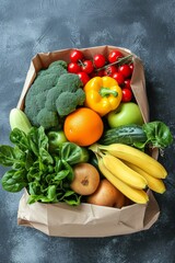 Wall Mural - A kraft bag with vegetables and fruits on a dark background. Food delivery