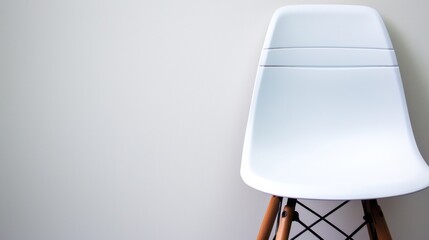 Sticker - A white chair with wooden legs against a wall, AI