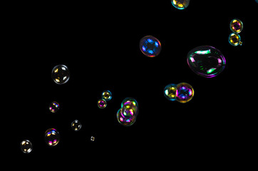 Sticker - Soap bubbles isolated on a black background