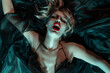 © Magryt - Young European woman having orgasm. Beautiful woman with open mouth and closed eyes enjoying sex lying in bed among black silk. Red lips, night light. Sexual experience, masturbation, cunnilingus.
