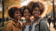 Multiracial female friends taking selfie with smart mobile phone outside in a park, Happy young people smiling at camera on city street, Youth community concept with women hanging out on sunny day
