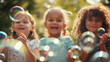 © Vika art - Children playing with soap bubbles.