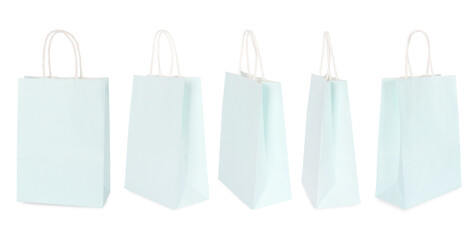 Wall Mural - Light blue shopping bag isolated on white, different sides