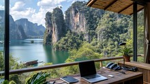 Laptop On Desk Overlooking Serene Lake