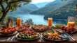  a table topped with plates of food next to a lake filled with oranges and other fruit and veggies.
