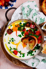 Wall Mural - Turkish eggs. cilbir.traditional breakfast dish. selective focus. hugge style