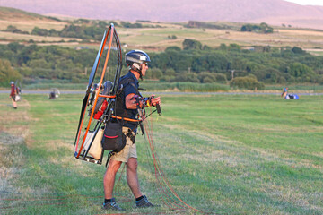 Poster - Paramotor pilot preparing to fly	