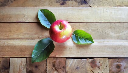 Sticker - apple with leaves on wooden background