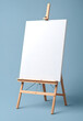 © bmf-foto.de - easel with blank canvas in front of a grey blue wall