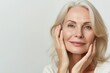 © Adriana - Beautiful gorgeous 50s mid aged mature woman looking at camera isolated on white. Mature old lady close up portrait. Healthy face skin care beauty, middle age skincare cosmetics