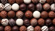 Assortment of luxury chocolate truffles in various shapes and flavors. Top view. Tasty background. Concept of confectionery, gourmet sweets, chocolate variety, luxury treats, assorted candies
