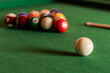 Cue ball in focus with billiard balls in triangle formation behind