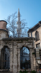 Wall Mural - A historical mausoleum from the Ottoman period in Sultanahmet Square and the mosque minaret behind it in Sultanahmet, Eminonu, Istanbul- Turkey