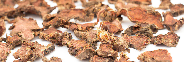 Wall Mural - finely chopped dried Rhodiola rosea root close-up on a white isolated background