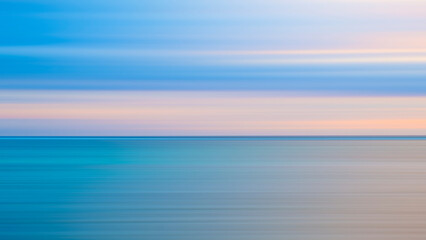 Poster - Abstract background of blue sea wave Motion blur sea water and beautiful sunset with clouds