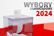 Transparent ballot box on a white-red background with the Polish inscription 