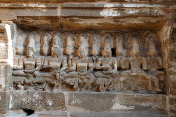 Bas relief of Hindu deity Sandstone sculpture. Ruins of ancient sculptures carved in the walls of Kanchi Kailasanathar temple in Kanchipuram, Tamilnadu.