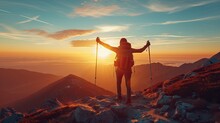Traveller In Mountains With A Backpack And Trekking Poles Rejoices At The Top During A Beautiful Sunset.