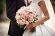Wedding. The bride and groom are standing close to each other, the bride is holding a bouquet of flower. Happy Wedding.