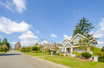 Wall Mural - two story stucco luxury house with nice summer  landscape in Vancouver, Canada, North America.