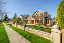 Two Story Stucco Luxury House With Nice Summer  Landscape In Vancouver, Canada, North America.