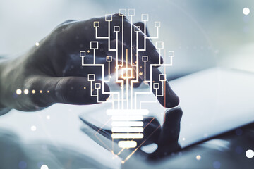 Poster - Creative light bulb with chip hologram and hand working with a digital tablet on background, artificial Intelligence and neural networks concept. Multiexposure