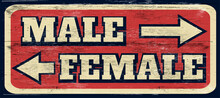 Aged And Distressed Male And Female Sign On Wood