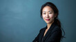 © JuanM - Young Asian businesswoman portrait with copy space for text background