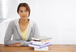 © Alexandra/peopleimages.com - Woman, student or thinking with books by desk, idea or learning for research of assignment. Young person, indian and thought by notebook on scholarship, studies and planning for test study in college