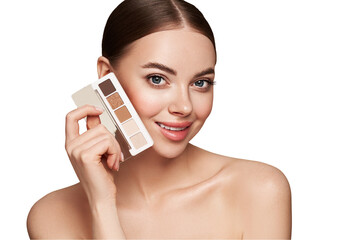 Wall Mural - beauty woman with eye shadow makeup palette. model with healthy perfect skin, close up portrait. cos
