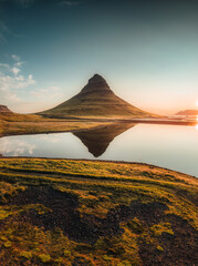 Wall Mural - Kirkjufell volcanic mountain reflect on lake in the morning at Iceland