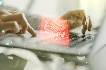 Poster - Multi exposure of creative fingerprint hologram with hands typing on computer keyboard on background, personal biometric data concept