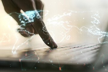 Poster - Abstract creative digital world map and hands typing on laptop on background, globalization concept. Multiexposure